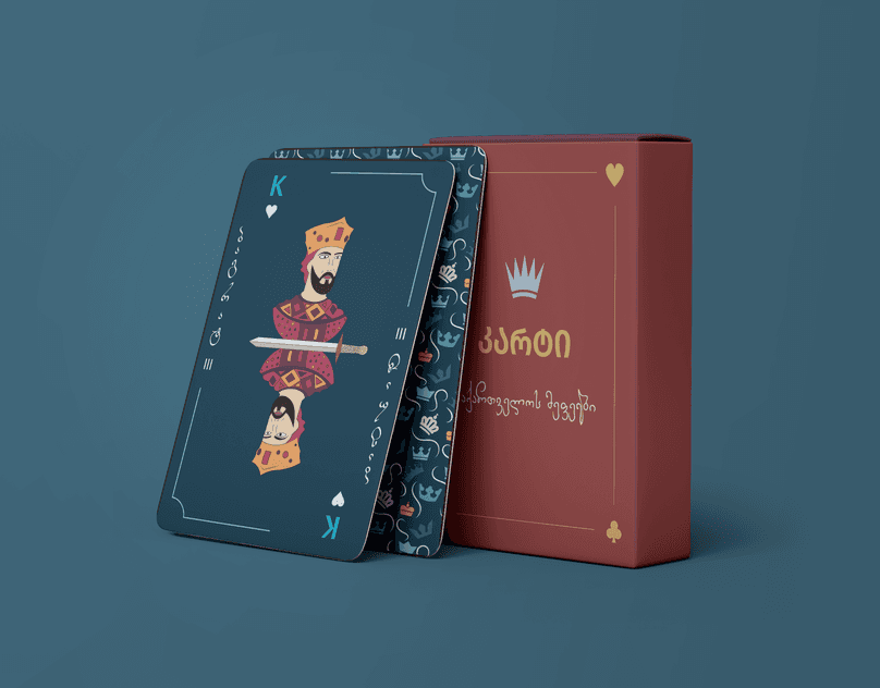 Illustrated playing cards and a red card box on a blue background